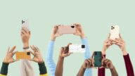 Social media audience crowd filming through smartphones